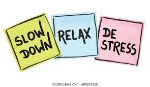 Three sticky notes reiterating destressing during application season. They read: "slow down, relax, and destress" in that order. 