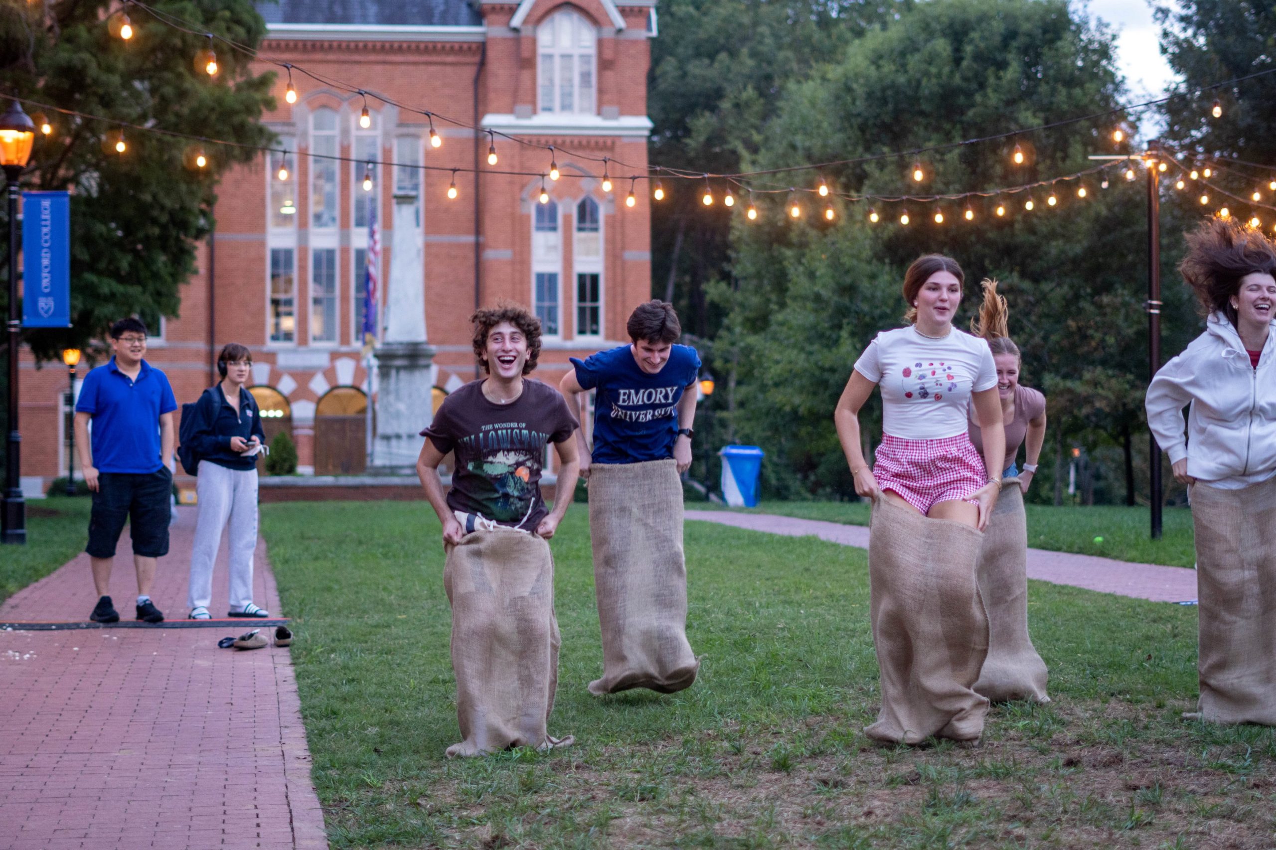 Students in a sack race on the quad